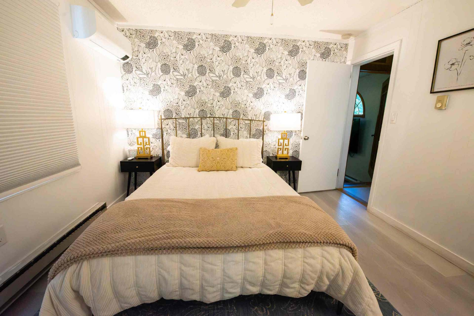 Guest bedroom with floral accent wall